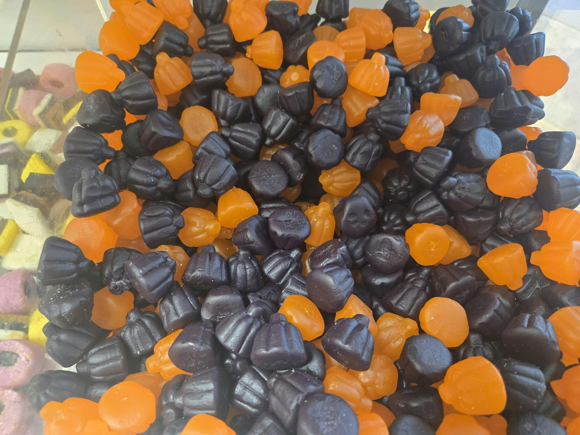 Swedish gummy pumpkin candies in a clear bin at the Tiger Treats pick-and-mix in Princeton, New Jersey