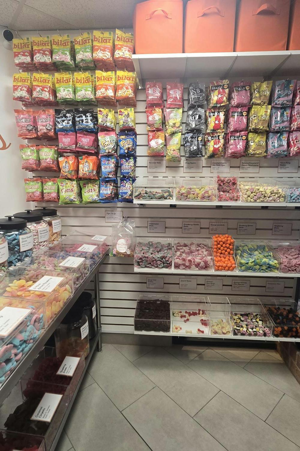 Inside Tiger Treats Swedish candy store in Princeton, New Jersey, pick-and-mix candy bags on the wall